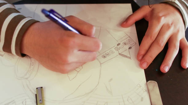 istock An Asian male student at an art school is working on a design assignment 1484828034