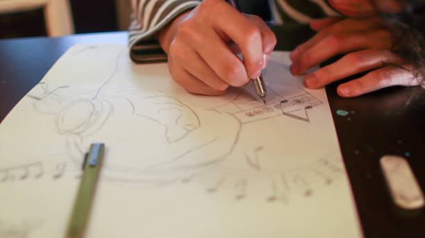 istock An Asian male student at an art school is working on a design assignment 1484828101