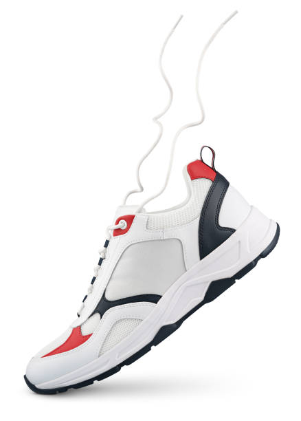 istock White sneaker with flying laces stands on the tip isolated on white 1484828148