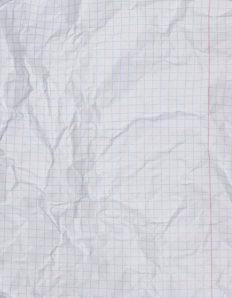 istock Crumpled sheet from a school notebook in a cage, a place for an inscription 1484828275