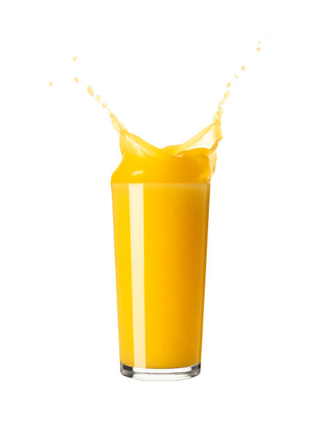 istock Orange juice splash in a glass isolated on white background 1484829923
