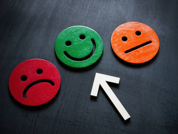 istock Positive emotion concept. The arrow points to a happy smiley. 1484835126