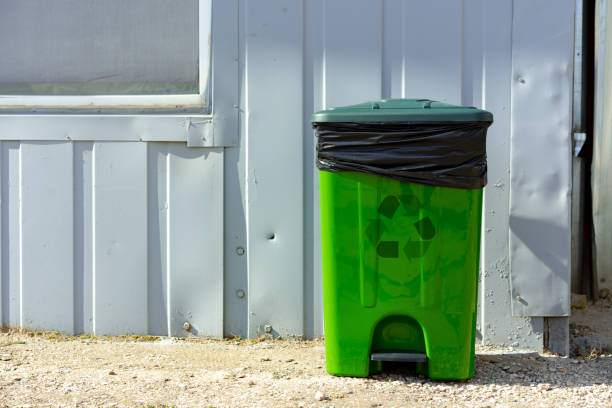 istock Green plastic garbage container standing in the street 1484836754