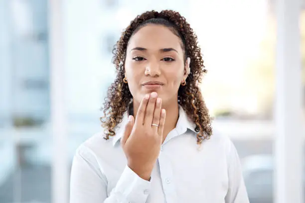 Photo of Portrait, deaf and black woman in office with thank you, hand and gesture on blurred mockup background. Face, cochlear implant and disability by girl employee sign language, symbol or communication