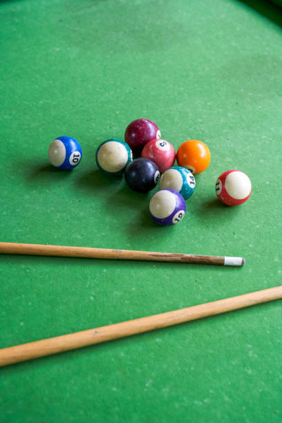 istock Billiards and pool cues on the pool table 1484838359