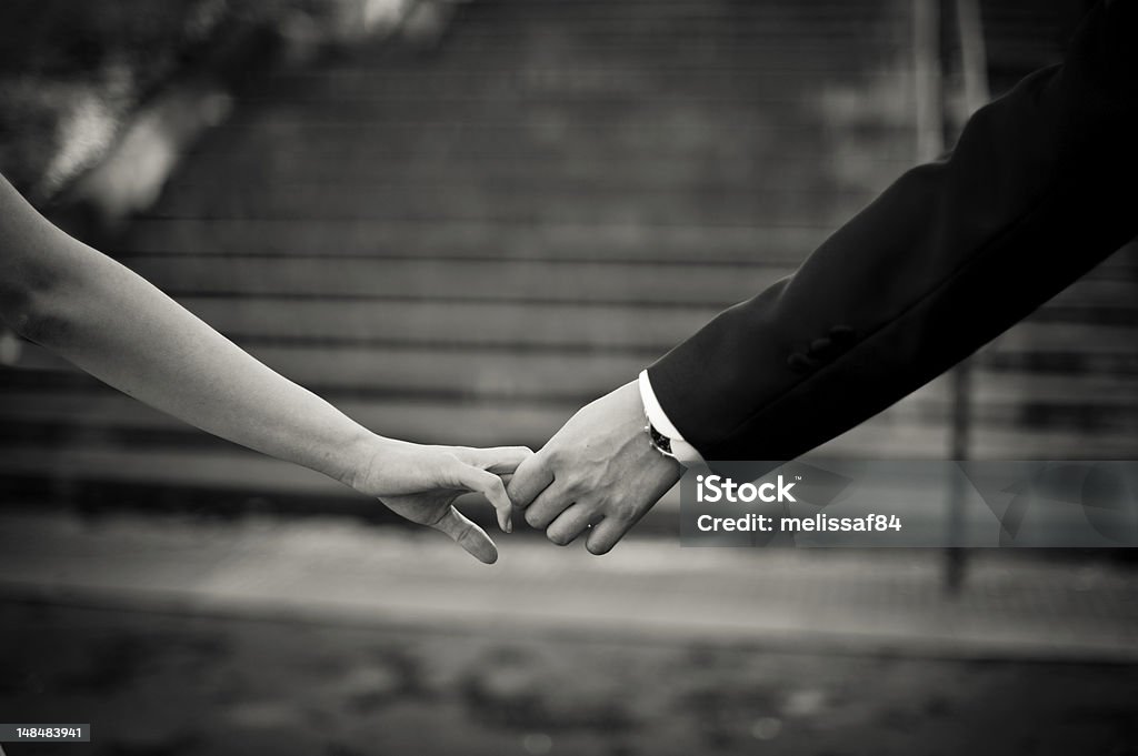 Holding hands Man and woman holding hands Bonding Stock Photo