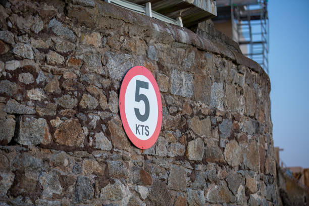 istock Nautical speed limit sign on harbour wall 1484840016