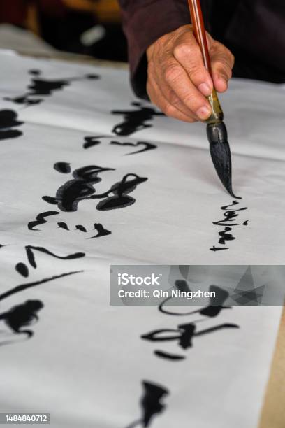 An Old Calligrapher Is Writing And Creating Calligraphy Works Translation It Rains On The Pond With Light Thunder Outside Liuwai And The Sound Of R Stock Photo - Download Image Now