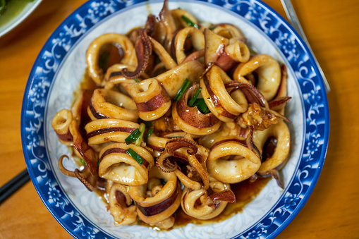 A delicious Chinese dish with fried fresh squid in sauce