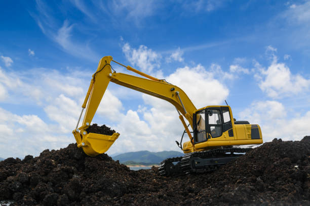 istock Yellow excavators are digging the soil in the construction site . 1484841498