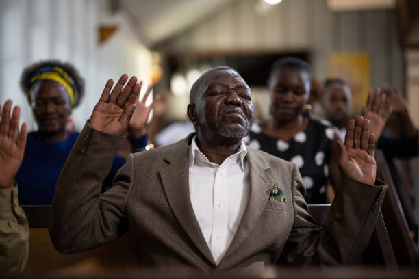 Multi-generation family and congregation enjoying church service