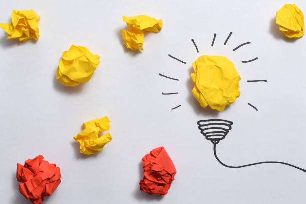 istock Creative idea, Inspiration, New idea and Innovation concept with Crumpled Paper light bulb on white background. 1484844306