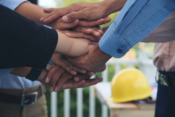 istock Diverse multiethnic Partners hands together teamwork group of multiracial people meeting join hands togetherness. Diversity people hands join empower partnership teams connection volunteer community 1484844841