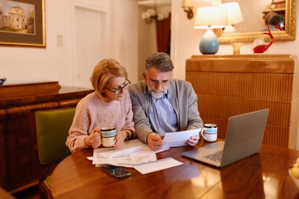 istock Mature couple paying bills from home 1484845208