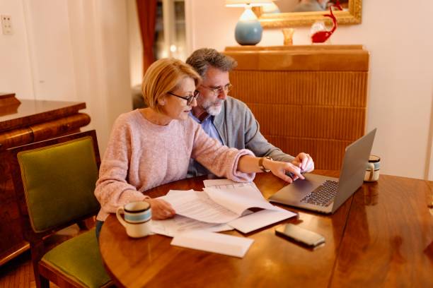 istock Modern woman and a man using technology for work at home 1484845542