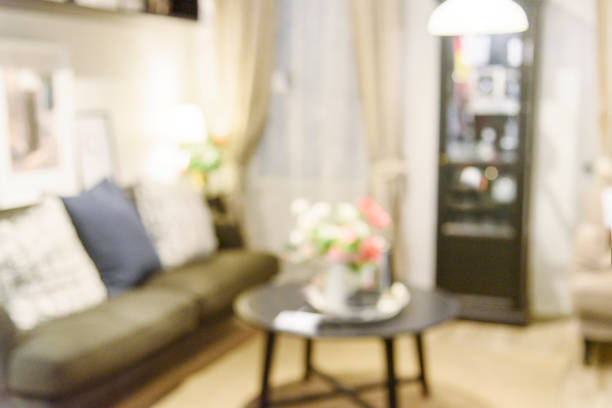 istock Blurred background cozy living room white background with copy space. Warm home interior bright simple living space. Home showcase interior light bokeh furniture decor. Home Blurry background concept 1484846056