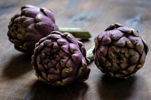 The globe artichoke is a variety of a species of thistle cultivated as a food.\nThe edible portion of the plant consists of the flower buds.