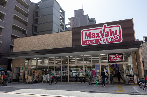 Fukuoka, Japan - April 22, 2023 : People at the AEON MaxValu Express Supermarket in Fukuoka, Kyushu, Japan.