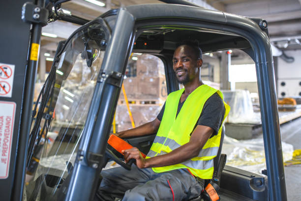 istock African American Airport Warehouse Worker Driving A Forklift 1484850897