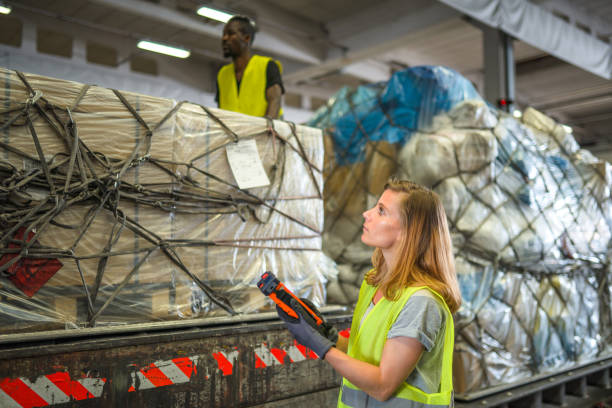 istock Diverse Airport Warehouse Coworkers Moving Cargo 1484851466