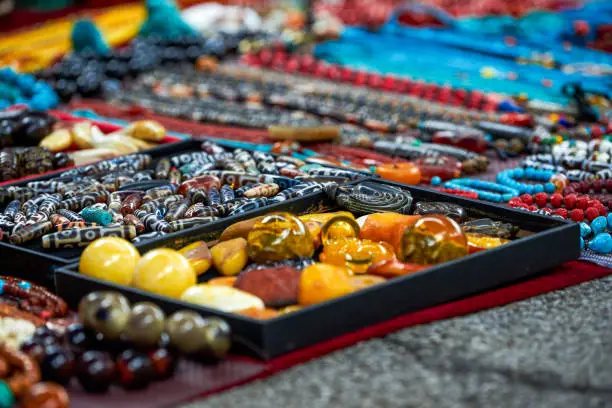 Photo of Colorful gemstone necklaces and pendants for sale in the market