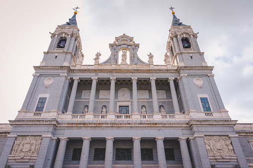 La Almudena Cathedral in Madrid, Spain with cloudy autumn sky