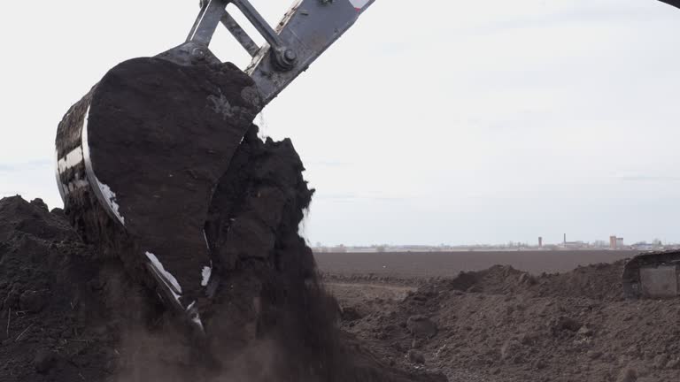 Еxcavator is digging a trench.