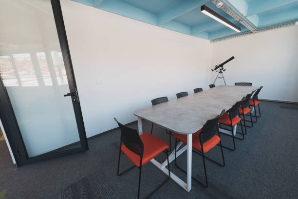istock Photo of a modern office where programming, digital marketing and web design projects are done. Office with modern furniture and glass office 1484858909