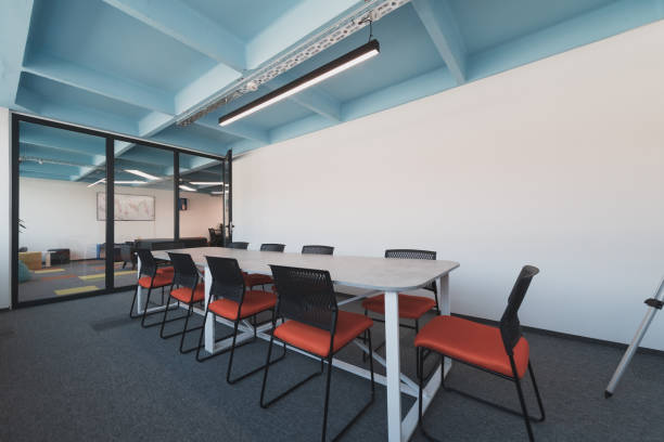 istock Photo of a modern office where programming, digital marketing and web design projects are done. Office with modern furniture and glass office 1484859723