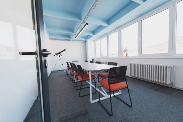istock Photo of a modern office where programming, digital marketing and web design projects are done. Office with modern furniture and glass office 1484859973