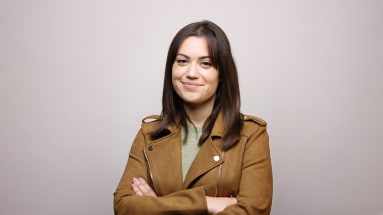 Portrait of beautiful woman with arms crossed