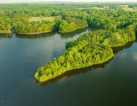 An aerial view of Lake Mackintosh surrounded by lush greenery. Burlington, North Carolina.