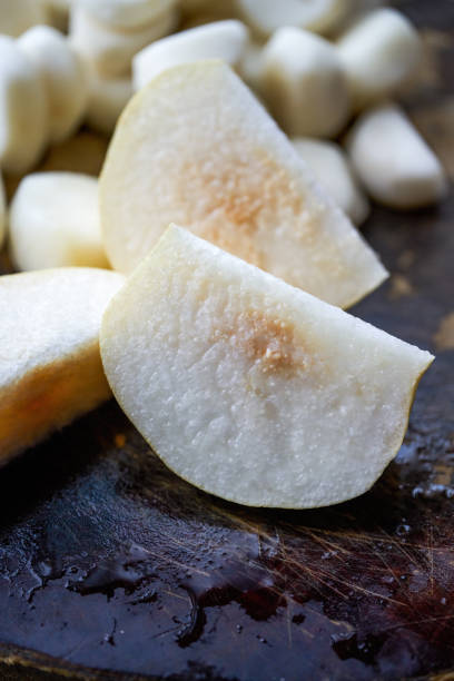 istock Close-up of a fresh pear cut on a cutting board 1484860868