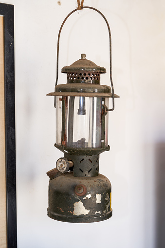 Electric Lantern lamp hanging from a wall outdoors