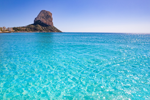 Penon de Ifach in Calpe turquoise beach of Mediterranean sea in Costa Blanca of Alicante in Spain