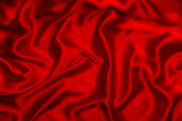 istock Red silk or satin luxury fabric texture can use as abstract background. 1484868017