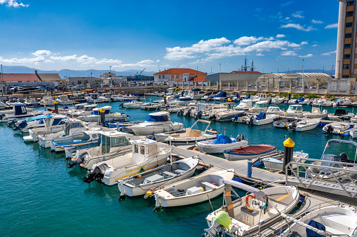 Gibraltar, UK - April 7, 2023: Many small boats anchored in the city port.