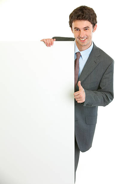 istock Modern businessman showing blank billboard and thumbs up gesture 148486818