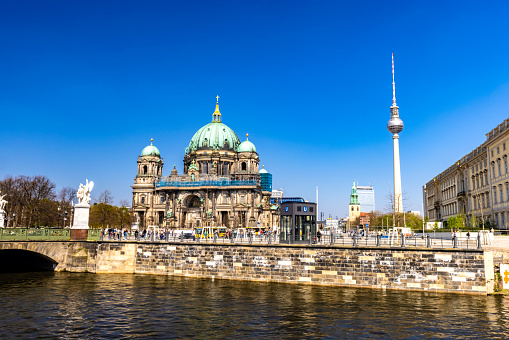 Two Crosses Berlin TV Tower Fernsehturm and Berlin Cathedral Berlin Germany. Tower constructed in 1960s by East German Communist Government and joke among East Germans was sun created cross. Tower tallest structure Cathedral largest Protestant Church in Germany