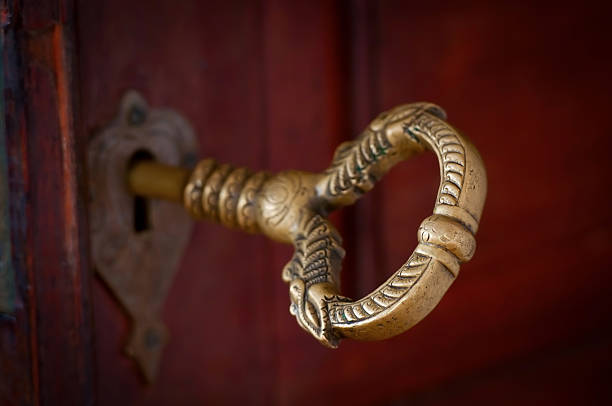 Close up view of keys in a lock of a new home door.
