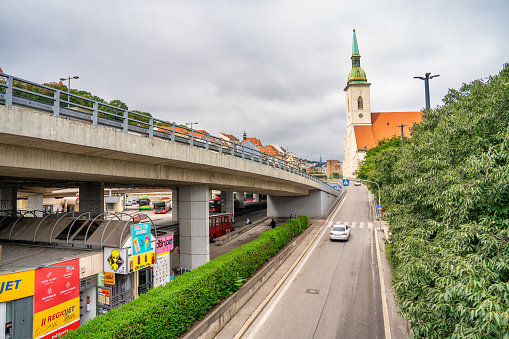 Bratislava, Slovakia - August 23, 2022: St. Martin Cathedral and main road along Danube River.