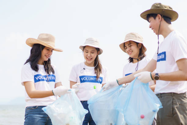 istock Volunteers picking up or cleaning a beach. 1484872194