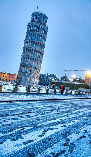 Pisa, Italy - March 1st, 2018: Snowfall in the streets of Square of Miracles.