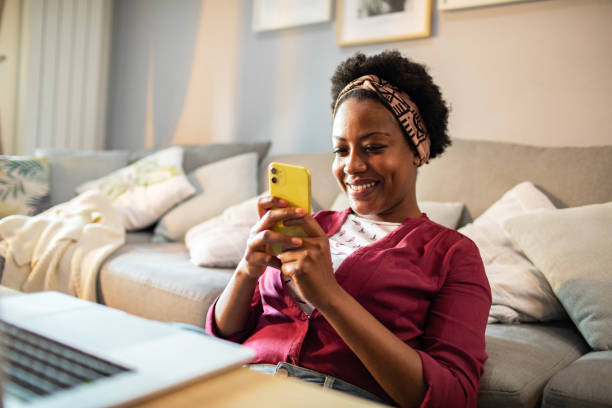 istock Young woman using a smart phone at home 1484874254