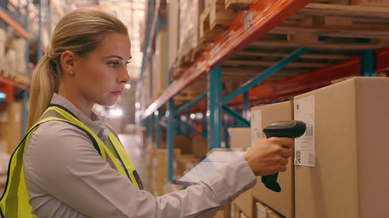 Tablet, label scan and woman in distribution warehouse for shipping, logistics and delivery for box barcode. Supply chain, ecommerce and female worker on digital tech for cargo, package and storage