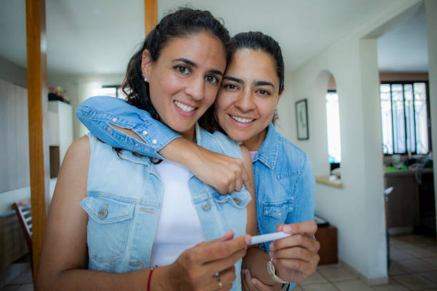 istock LGBT couple with pregnancy test 1484877524