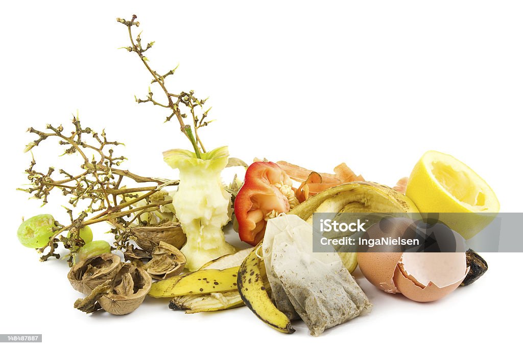 Waste food ready for compost on a white background Small heap of compost on white. Garbage Stock Photo