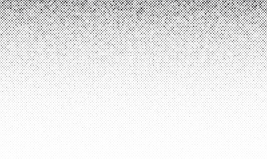 Abstract dot halftone background. Gray dots with random size in seamless design.