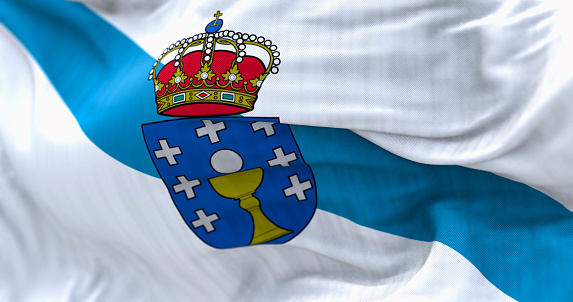 Detail of the Galicia flag waving. Autonomous community of Spain. White with a blue diagonal band with coat of arms on top. 3d illustration render. Selective focus. Close-up. Fluttering fabric
