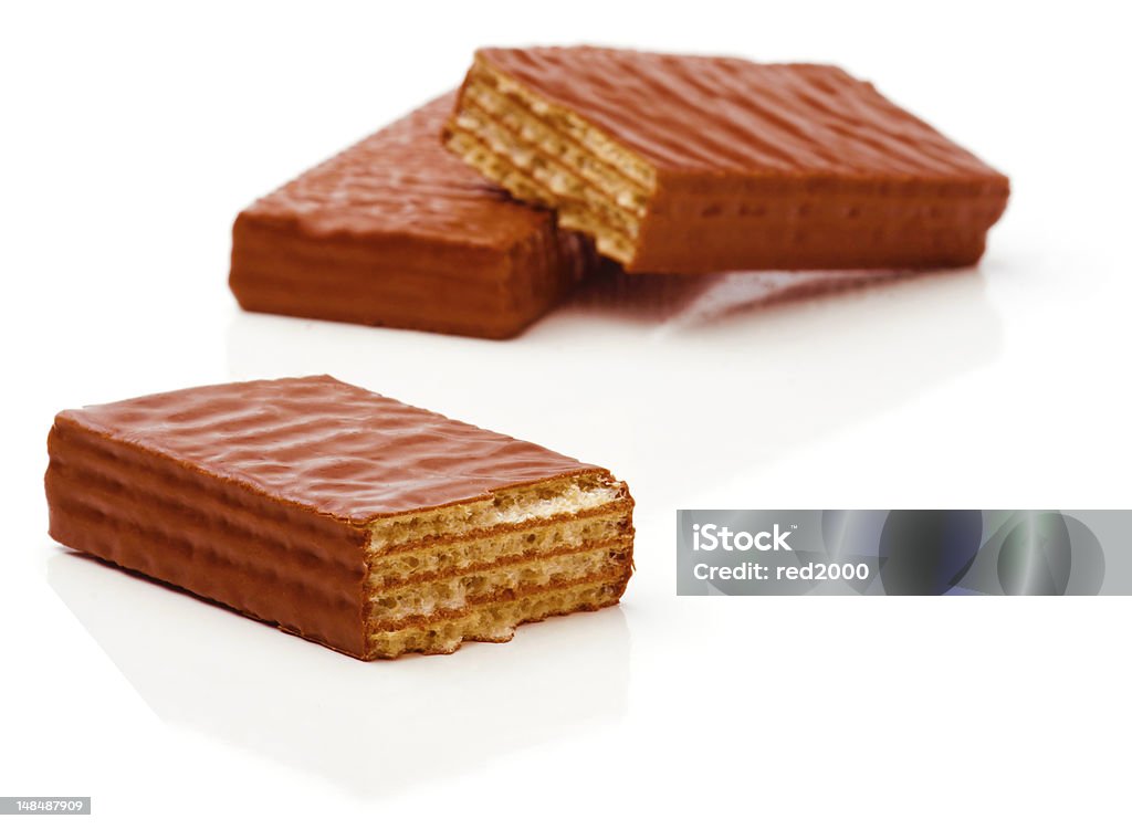 Waffles Broken chocolate waffles on a white background. Soft focus. Baked Pastry Item Stock Photo